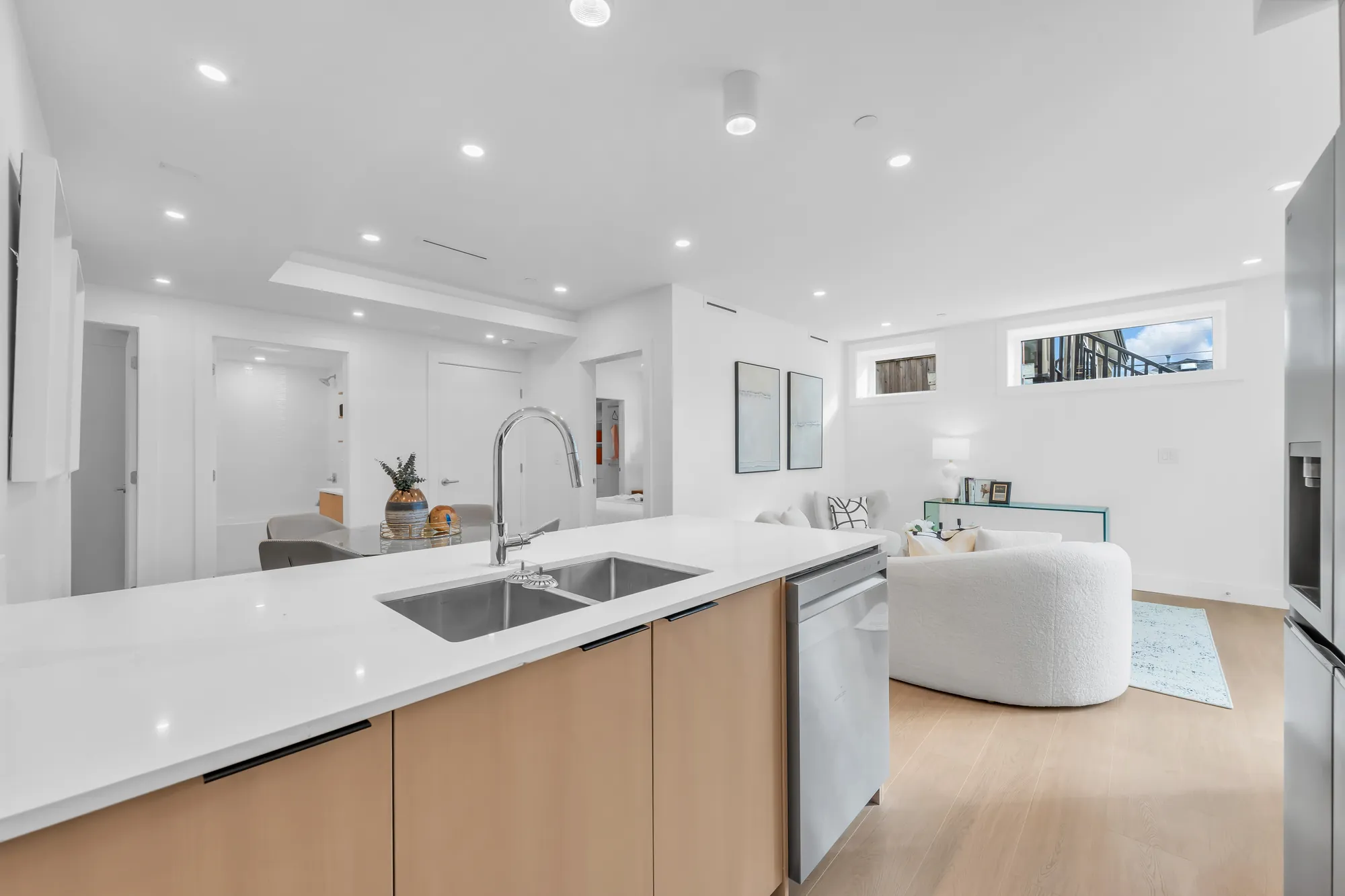 The sink in the peninsula, looking over the counter to the living room
